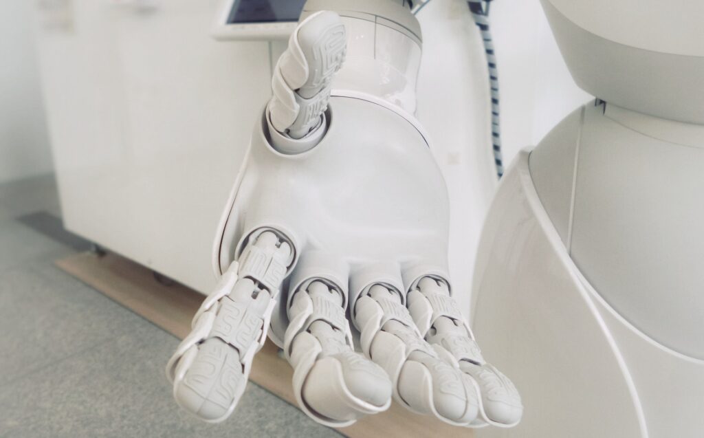 An AI robot extends it's hand in effort to help